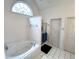 Relaxing bathroom featuring a large jetted tub and separate shower at 3559 Gus Way, Powder Springs, GA 30127