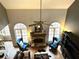 High ceiling living room with stone fireplace and built in shelving at 3559 Gus Way, Powder Springs, GA 30127