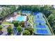 Aerial view of community pool, water slides, and multiple tennis courts at 1400 Lamont Cir, Dacula, GA 30019