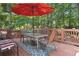 Relaxing back deck with outdoor furniture and shade is perfect for outdoor gatherings at 1400 Lamont Cir, Dacula, GA 30019