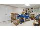 Finished basement featuring a storage closet, a small window, and a vintage looking table with chairs at 1400 Lamont Cir, Dacula, GA 30019