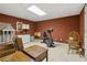 Spacious unfinished basement ready for personalization, featuring a vintage dollhouse and workout equipment at 1400 Lamont Cir, Dacula, GA 30019