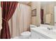 Neutral bathroom with a white sink and vanity, and a shower with a curtain at 1400 Lamont Cir, Dacula, GA 30019