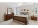 Nicely decorated bedroom with wooden bed frame, ceiling fan and plantation shutters at 1400 Lamont Cir, Dacula, GA 30019