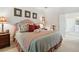 Charming bedroom featuring floral accents, a tray ceiling and an attached bathroom, providing comfort and style at 1400 Lamont Cir, Dacula, GA 30019