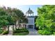 Community lift station featuring decorative masonry, lush trees, and manicured lawn at 1400 Lamont Cir, Dacula, GA 30019
