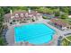 Aerial view of a large community pool with ample seating and a clubhouse in a well-maintained neighborhood at 1400 Lamont Cir, Dacula, GA 30019