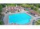A large community pool is surrounded by lounge chairs and a clubhouse with parking at 1400 Lamont Cir, Dacula, GA 30019