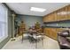A dining area in the bonus room featuring a kitchenette and a round wooden table set at 1400 Lamont Cir, Dacula, GA 30019