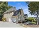 Traditional home with a side entry garage and lush landscaping at 1400 Lamont Cir, Dacula, GA 30019