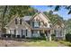 Charming home featuring manicured landscaping, a welcoming porch, and a classic design with a mix of materials and textures at 1400 Lamont Cir, Dacula, GA 30019