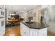 A bright, modern kitchen with white cabinets and stainless steel appliances, and island at 1400 Lamont Cir, Dacula, GA 30019