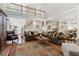 Open-concept living room showcasing a second-story balcony, hardwood floors, and an inviting atmosphere at 1400 Lamont Cir, Dacula, GA 30019
