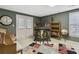 Relaxing living room with an accent rug, a bar and seating, and a bookcase at 1400 Lamont Cir, Dacula, GA 30019