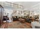 Open-concept layout featuring living room with fireplace and a view of the upper level loft and the foyer at 1400 Lamont Cir, Dacula, GA 30019