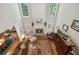 Open living room boasts high ceilings, a stone fireplace, and abundant natural light, creating a welcoming atmosphere at 1400 Lamont Cir, Dacula, GA 30019