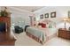 A serene main bedroom with a tray ceiling, ample natural light, and tasteful decor at 1400 Lamont Cir, Dacula, GA 30019