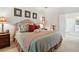 A well-decorated main bedroom with neutral tones, a comfortable bed, and stylish furnishings at 1400 Lamont Cir, Dacula, GA 30019