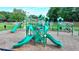 Community playground area with slides, climbing equipment, and safety mulch at 1400 Lamont Cir, Dacula, GA 30019