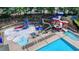 Community pool and splashpad area with slides, seating and fenced perimeter at 1400 Lamont Cir, Dacula, GA 30019