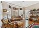 Inviting sun room with hardwood floors, lots of natural light, and seamless access to backyard at 1400 Lamont Cir, Dacula, GA 30019