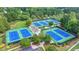 Aerial view of community tennis courts surrounded by lush greenery at 1400 Lamont Cir, Dacula, GA 30019