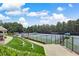 Community tennis courts with a covered patio overlooking the courts at 1400 Lamont Cir, Dacula, GA 30019