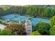 Tennis courts with covered spectator areas and lush landscaping at 1400 Lamont Cir, Dacula, GA 30019