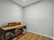 Simple basement office with desk and shelving at 238 Walker Sw St # 39, Atlanta, GA 30313