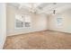 Large bedroom with neutral carpeting and plenty of natural light at 276 Villa Grande Dr, Locust Grove, GA 30248