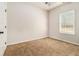 Simple bedroom with carpet and window with shutters at 276 Villa Grande Dr, Locust Grove, GA 30248