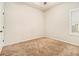 Well-lit bedroom with carpet and neutral walls at 276 Villa Grande Dr, Locust Grove, GA 30248