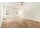 Bright bedroom with ceiling fan and neutral carpeting at 276 Villa Grande Dr, Locust Grove, GA 30248