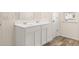 Bathroom vanity with double sinks, drawers, and a large mirror at 345 Sound Cir # 134, Stockbridge, GA 30281
