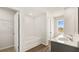 Bright bathroom features a double sink vanity and a view from the window at 345 Sound Cir # 134, Stockbridge, GA 30281