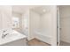 Bright bathroom features a double sink vanity and a tub at 345 Sound Cir # 134, Stockbridge, GA 30281