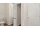 A toilet is located in an unfinished room near a closet and a closed door at 345 Sound Cir # 134, Stockbridge, GA 30281