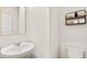 Powder room featuring a pedestal sink and a floating shelf at 345 Sound Cir # 134, Stockbridge, GA 30281