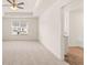 Spacious main bedroom with carpet flooring and a ceiling fan at 345 Sound Cir # 134, Stockbridge, GA 30281
