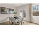 Bright dining room featuring a large window and access to the outdoor balcony at 345 Sound Cir # 134, Stockbridge, GA 30281