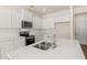 Beautiful kitchen features white countertops, stainless steel appliances, and a modern faucet at 345 Sound Cir # 134, Stockbridge, GA 30281