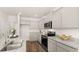 Modern kitchen featuring granite countertops, stainless appliances, and ample cabinetry at 345 Sound Cir # 134, Stockbridge, GA 30281
