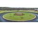 Community entrance with circular fountain and manicured landscaping at 345 Sound Cir # 134, Stockbridge, GA 30281