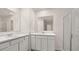 Bathroom with double sink, white cabinets, and glass shower at 487 Reflection Dr # 34, Stockbridge, GA 30281