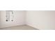 Carpeted bedroom with view of exterior at 487 Reflection Dr # 34, Stockbridge, GA 30281