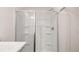 Bathroom shower with shelves and glass doors at 487 Reflection Dr # 34, Stockbridge, GA 30281