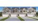 New construction townhomes featuring attached garages and a variety of neutral color schemes at 487 Reflection Dr # 34, Stockbridge, GA 30281