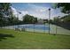 Well-maintained tennis courts with benches and surrounding fencing at 131 Paddington Pl, Acworth, GA 30101