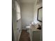 Cozy half bath featuring neutral tones, updated fixtures and tiled floors at 3230 Vanderbilt Nw Ln, Atlanta, GA 30318