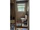 Under-construction bathroom with plumbing and electrical exposed and a small window at 3230 Vanderbilt Nw Ln, Atlanta, GA 30318